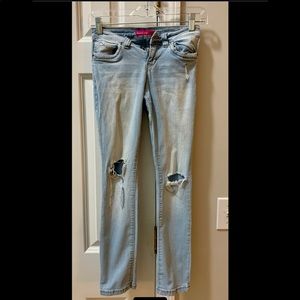 Light wash ripped distressed jeans.